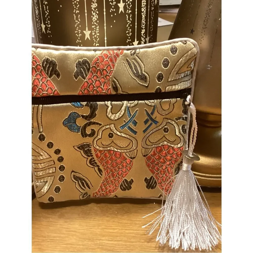 NWT. Gold Embroidered Fish Tassel Wristlet Clutch